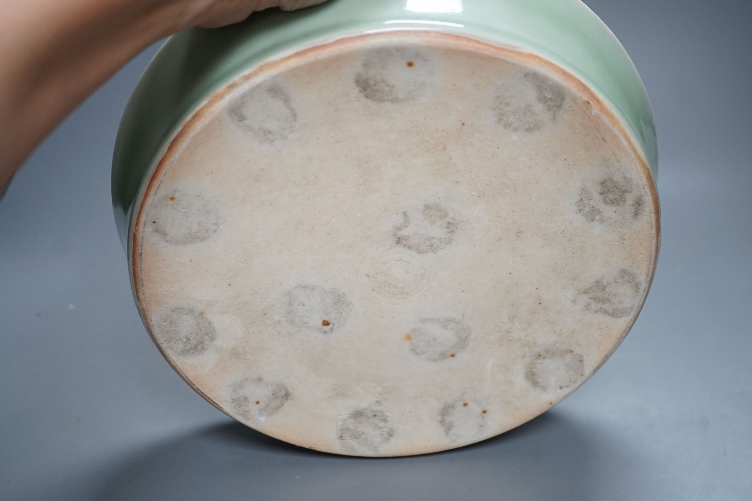 A Korean celadon glazed dish, 19th / 20th century-27 cms diameter.
